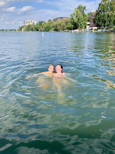 two people are floating in the water together