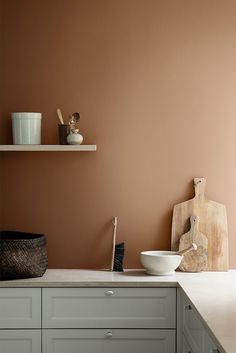 the kitchen counter is clean and ready to be used as a storage area for cooking utensils