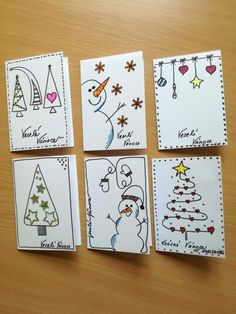 four christmas cards with different designs on them