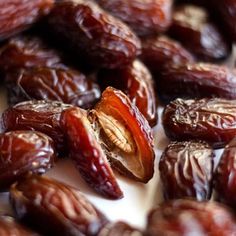 some raisins are sitting on a white surface