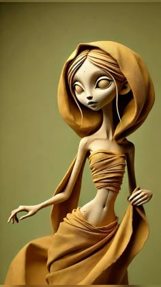 a doll is wearing a dress and head scarf