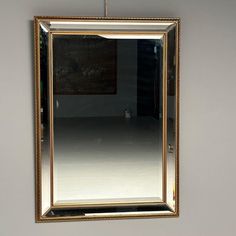 a large mirror hanging on the wall