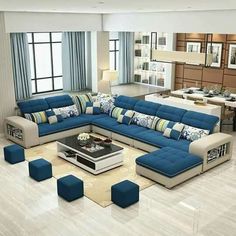 a living room filled with blue and white furniture