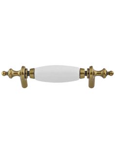 an antique style brass finish door handle with white glass knobs and two gold plated handles