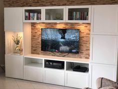 an entertainment center with built in bookshelves is featured on the instagram page