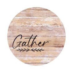 a round wooden sign with the word gather written on it and an arrow in the center