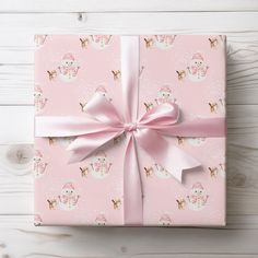 a pink gift box with a bow on it