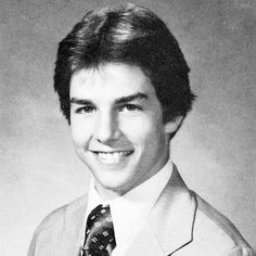 a young man wearing a suit and tie