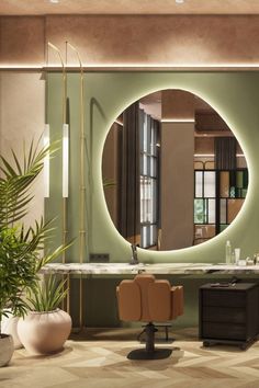 a bathroom with a large round mirror on the wall next to a desk and chair