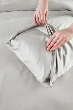 Introducing our Bamboo Housewife Pillowcases, crafted from 100% sustainably sourced bamboo for an unparalleled night's sleep. Experience the silky-soft touch of this unique fabric, enhancing your bedding with its premium feel. These housewife pillowcases boast a 300 thread count, ensuring durability and comfort. As bamboo becomes softer with each wash, caring for them is effortless. Bamboo fabric, known for its thermoregulating properties, antibacterial nature, natural composition, and hypoaller Grey And Rose, Bamboo Bedding, Unique Fabric, Elegant Sets, Cloud White, Bamboo Fabric, Eco Conscious, Rose Pink, Pink Roses