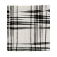 a black and white plaid blanket on a white background