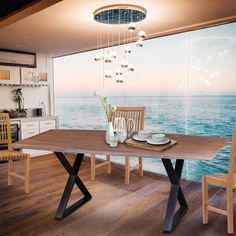 a dining room table with two chairs and a vase on it in front of a window overlooking the ocean