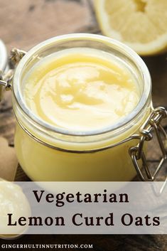 a jar filled with lemon curd oats sitting on top of a wooden table