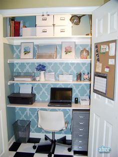 a desk with a laptop computer on top of it next to a checkered floor