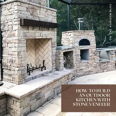 an outdoor kitchen with stone veneer