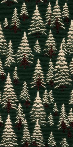 a green and white knitted christmas tree pattern