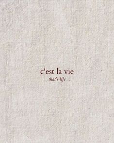 the words are written in red on a white linen material background that says, cest la vie that's life