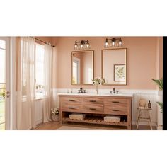 a bathroom vanity with two mirrors above it and a door leading to the outside patio