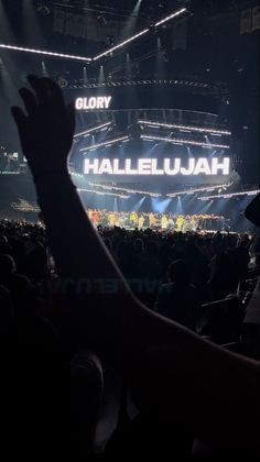 the audience at a concert is raising their hands up to see what they are doing