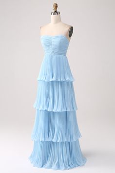 a light blue dress on a mannequin headdress with pleated layers