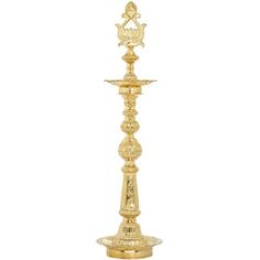 a gold colored candle holder on a white background