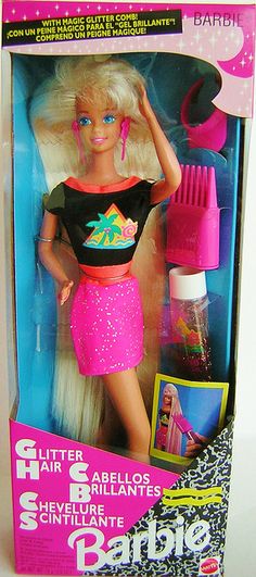 the barbie doll is wearing a pink skirt and black shirt with sequins on it