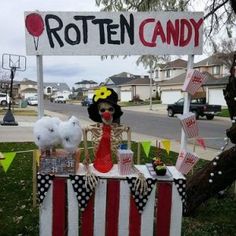 a sign that says rotten candy on top of a table with an american flag decoration