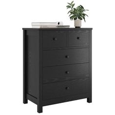 a black dresser with drawers and a potted plant