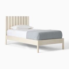 the bed is made up and ready for someone to use it in their home or office