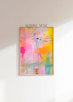 an abstract painting hangs on the wall above a bed in a room with white walls