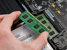 someone is removing the motherboard from their laptop