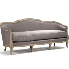 an old style couch with wooden legs and grey upholstered fabric on the back