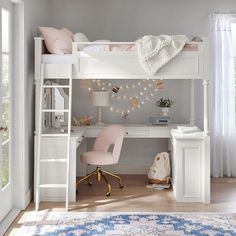 a white loft bed sitting next to a desk