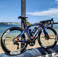 a bike parked on top of a wooden dock