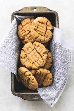 some cookies are in a metal pan on a table