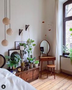 a bedroom with lots of plants on the wall