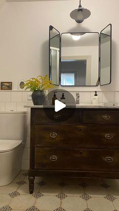 the bathroom is clean and ready to be used as a home decor piece in this video