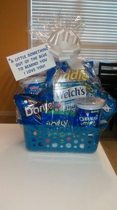 a blue basket filled with lots of candy