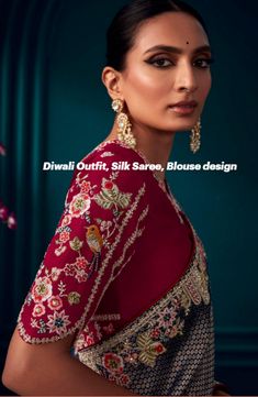 a woman in a red blouse and gold earrings