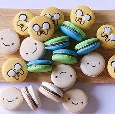 some macaroons with faces painted on them