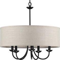 a chandelier with three lights and a beige shade on the drum light fixture