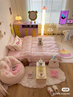 a bedroom with pink and white bedding, teddy bear rugs and other furniture