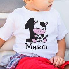 Celebrate your little one's first birthday in style with our adorable Boy 1st Birthday Cow Number 1 T-Shirt! This cute and comfortable shirt will make a perfect outfit for the special day. Make it even more memorable by customizing it with your little boy's name. #FirstBirthday #CowTheme #BoyBirthday #NumberOne #BirthdayOutfit #PersonalizedShirt #CuteDesign #1stBirthdayParty #ToddlerFashion #BirthdayCelebration Holy Cow Im One, Birthday Cow, Kids Birthday Shirts, Boy Shirt, Holy Cow, Top Baby Products, 1st Boy Birthday, Baby Shirts, Silhouette Cut