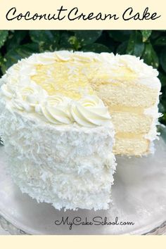 a close up of a cake on a plate with the words coconut cream cake above it