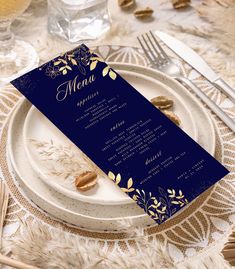 a menu card sitting on top of a plate next to silverware and utensils