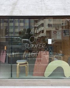 a store window with the words land of summer nights written on it