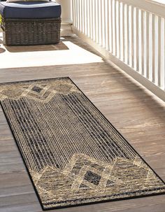 an outdoor area rug on the front porch