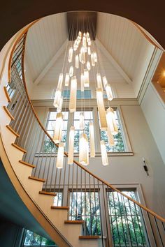 a spiral staircase with lights hanging from it