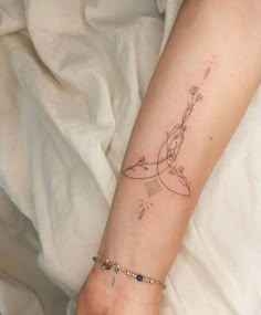 a woman's arm with a tattoo on it