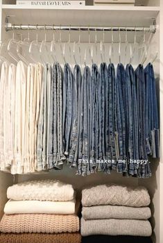 an organized closet with folded jeans and linens